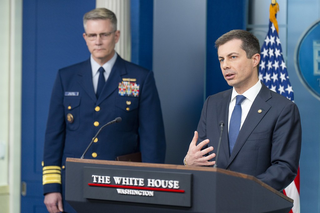 Pete Buttigieg speaking at the White House press briefing room podium